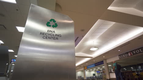 Metal-recycling-bin-inside-airport