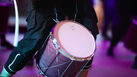 Close-up-of-a-musician-playing-on-a-drum-in-a-live-concert