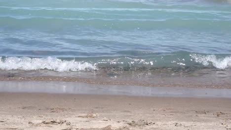 Smalls-waves-crashing-to-beach-shoreline