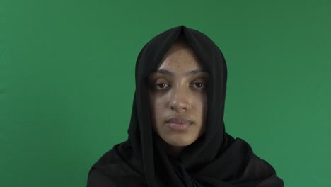 Young-Ethnic-Muslim-Female-Wearing-Hijab-Looking-At-Camera