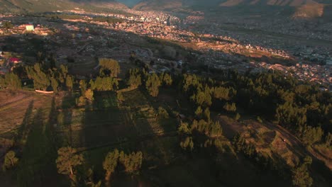 4k-aerial-drone-footage-over-the-lush-green-hills-and-mountains-in-the-Northern-side-of-Cusco-in-Peru-at-sunset