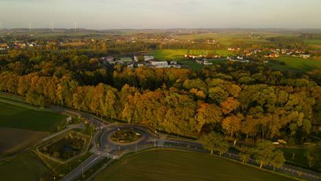 Aerial-View-Of-Roundabout-In-Town-Of-Lubawa,-Poland-During-Autumn---drone-shot