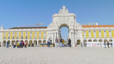 A-long-view-of-The-Rua-Augusta-Arch-historical-building-and-visitor-in-Lisbon,-Portugal