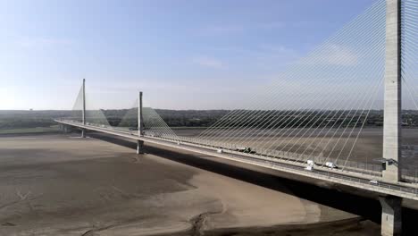 Vehicles-crossing-over-landmark-river-Mersey-gateway-bridge-aerial-view-static