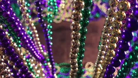 curtain-of-Mardi-Gras-beads-parting-to-reveal-colorful-bead-border-with-copy-space