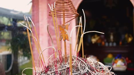 Burning-Incense-Sticks-In-A-Buddhist-Temple-At-Tam-Coc,-Vietnam