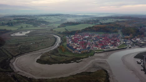 Aerial-footage-moving-forward-over-Wivenhoe-in-Essex-at-sunrise-with-mist-and-the-bend-of-the-river-colne