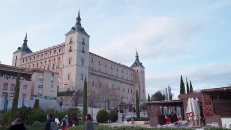 People-Roaming-Around-The-Iconic-Building-Of-Alcazar-De-Toledo-In-Toledo,-Spain-On-A-Fine-Weather---wide-shot