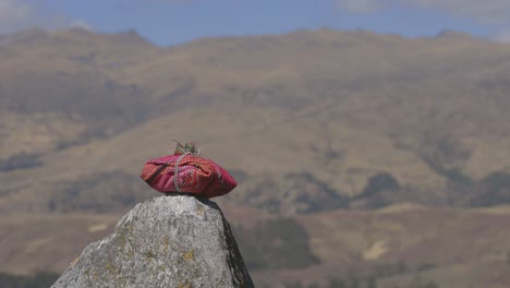 Ceremonial-bundle-sits-atop-a-stone-in-Peru