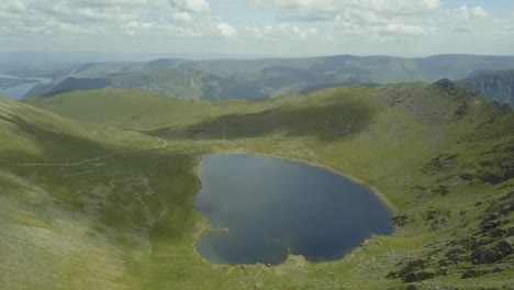 Aerial-drone-footage-of-mountains-and-a-lake-in-the-Lake-District,-England
