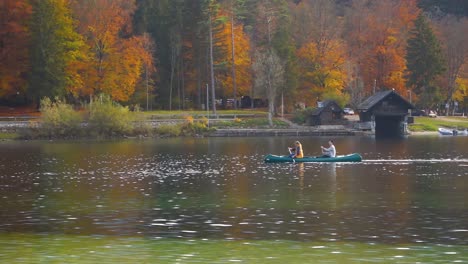 People-canoeing-on-the-lake-Bohinj-on-a-autumn-day-in-Slovenia
