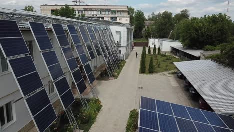 Solar-Garage-And-Vertical-Panel-Installation,-Aerial-View
