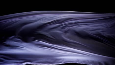 Beautiful-purple-silk-floating-in-black-background--close-up