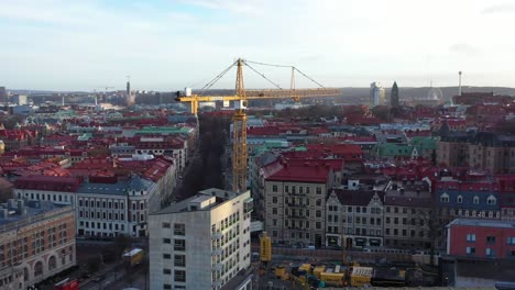 Aerial-footage-over-crane-in-Gothenburg-city,-Sweden