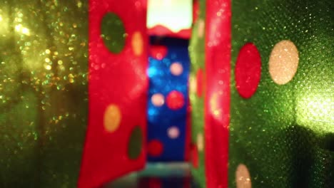 Out-of-focus-on-illuminated-Christmas-presents-for-abstract-lighting-effect