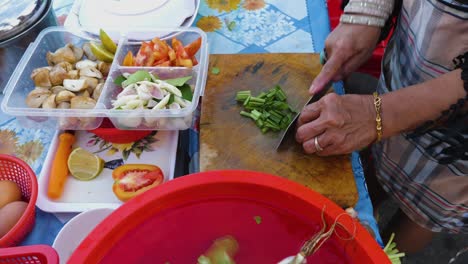 Vegetables-being-cut-and-prepared-for-Tom-Yam-Kung-soup-in-Thailand