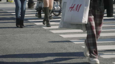 People-Crossing-The-Road-At-The-Shibuya-Crossing-During-The-Pandemic-On-A-Sunny-Day-In-Tokyo,-Japan