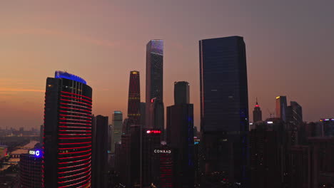 Guangzhou-CBD-downtown-office-building-district-at-colorful-late-sunset