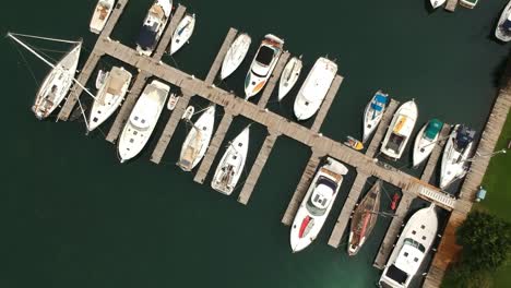 Aerial-shot-over-a-marina-filled-with-sailboats