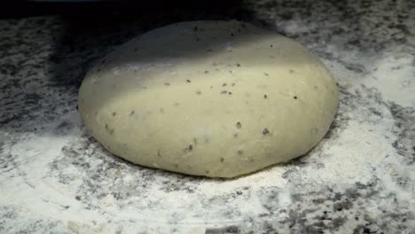 Bread-dough-is-hidden-under-blue-bowl-and-then-is-revealed-by-the-baker