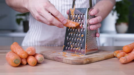 Grating-Carrot-In-The-Kitchen-For-Baking-Cake