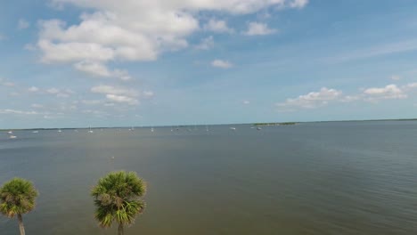 Indian-River-near-the-City-of-Titusville-Florida-on-a-beautiful-morning-with-palm-trees-and-clouds
