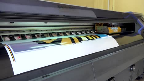Large-format-printer-printing-high-quality-color-livery-sticker-close-up