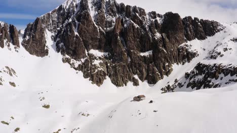 Aerial-approach-of-Cima-d'Asta-summit-of-Dolomite-mountain-range-covered-with-snow