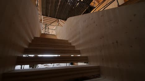 Building-site-under-construction-with-stairs-and-wooden-walls-and-roof