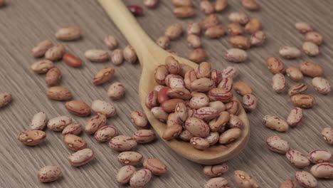 Red-dry-beans-on-wooden-spoon,-vegan-vegetarian-ingredient,-healthy-food-Mediterranean-diet,-organic-agriculture