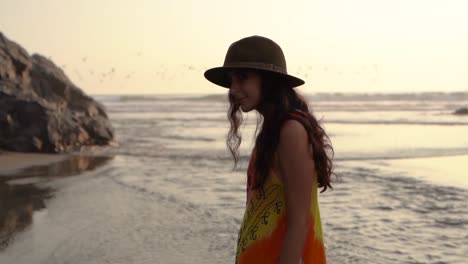 young-woman-admiring-sea-at-sunset-in-slow-motion