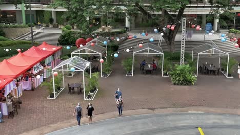 Open-air-stall-area-at-a-mall-decorated-with-red,-white-and-blue-balloons-of-the-American-and-Philippine-flags-to-commemorate-Philippine-American-friendship-on-July-4