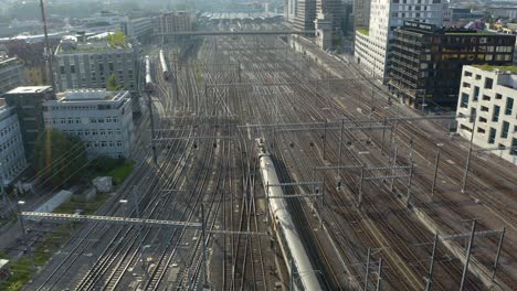 Fixed-Aerial-Shot-of-Train-Arriving-at-Zurich's-Central-Station