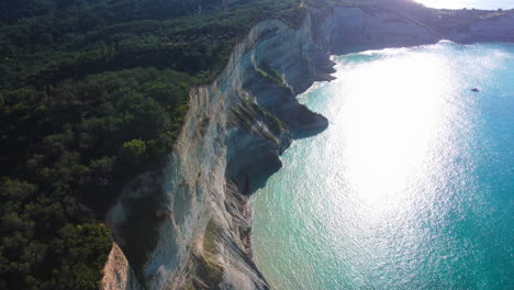 Flight-over-high-cliffs-of-sea-coast,-aerial-view
