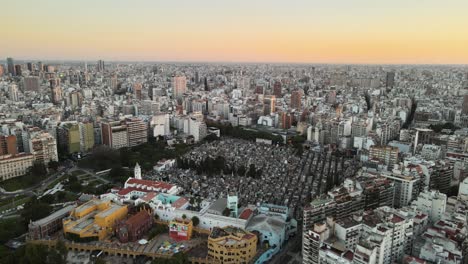 Aerial-establishing-shot-of-La-Recoleta-Cemetery-in-downtown-Buenos-Aires-at-sunset