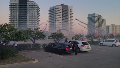 Fire-Trucks-Extinguishing-Massive-Fire-At-Paramount-Fine-Foods-Restaurant-Near-High-rise-Apartment-Buildings-In-Mississauga,-Canada