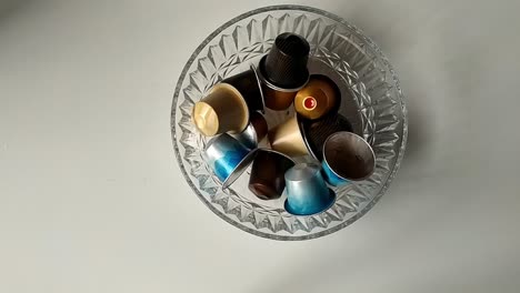 Clear-glass-full-of-coffee-machine-capsules-seen-from-above
