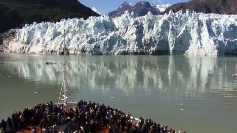Cruises-in-Alaska-in-the-summertime,-passengers-on-the-bow-of-the-ship