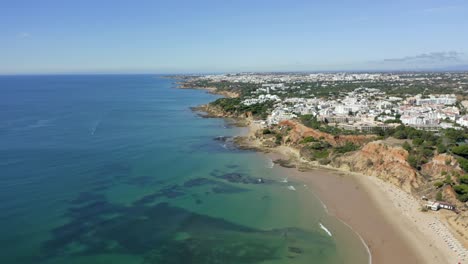 Bird's-Eye-View-Of-Barranco-das-Belharucas-Beach-With-Tui-Blue-Falesia-Hotel-And-Albufeira-City-In-Portugal