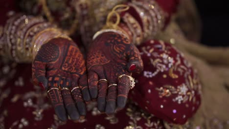 Vibrant-Henna-Mehndi-Design-On-Brides-Open-Palms-On-Wedding-Day