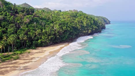 Tropical-beach-in-Caribbean-sea,-Playa-Coson-in-Dominican-Republic---aerial-drone-shot