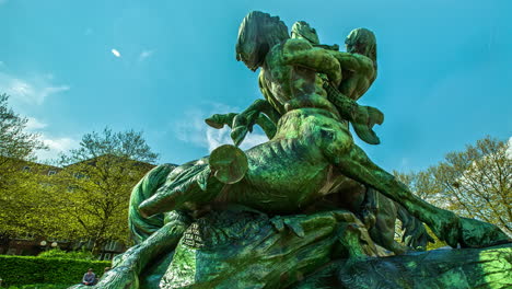 Time-lapse-with-a-wide-low-angle-top-view-shot-of-the-statue-in-Hamburg-in-a-clear-blue-sky-background