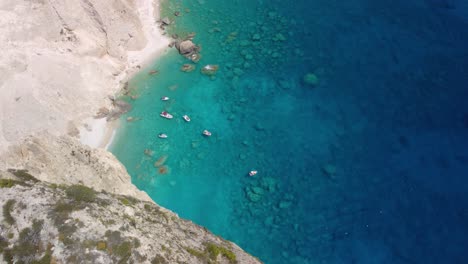 Pleasure-boats-anchored-at-Mizithres-cliff-rock-in-Zakynthos-Ionian-island,-Greece