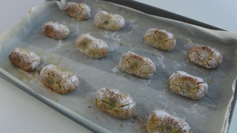 Freshly-baked-chewy-pistachio-amaretti-Christmas-cookies-on-a-baking-sheet