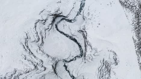 Snowy,-deep-and-narrow-Kotárgil-canyon-in-Norðurárdalur-in-north-iceland---aerial-shot