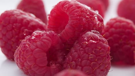 Fresh-raspberries,-Water-drops-falling-over-Small-red-berries---Ultra-Slow-motion-Close-up