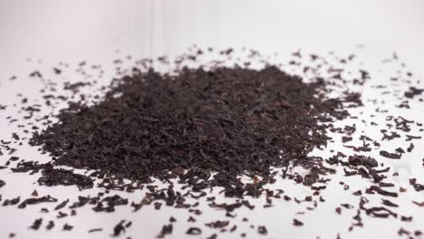 Making-A-Heap-Of-Dried-Black-Tea-On-White-Background---close-up