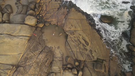 Drone-shot-of-rocks-and-ocean