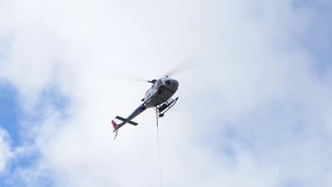 Eurocopter-AS-350B-3-helicopter-comes-down-with-a-sling-load