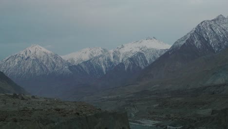 Aerial-Establishing-Shot-Of-Snow-Capped-Mountains-In-Hunza-Valley